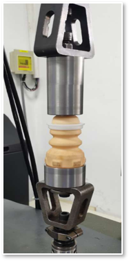Jounce bumper under compression test on the Croslynk 50 kN UTM